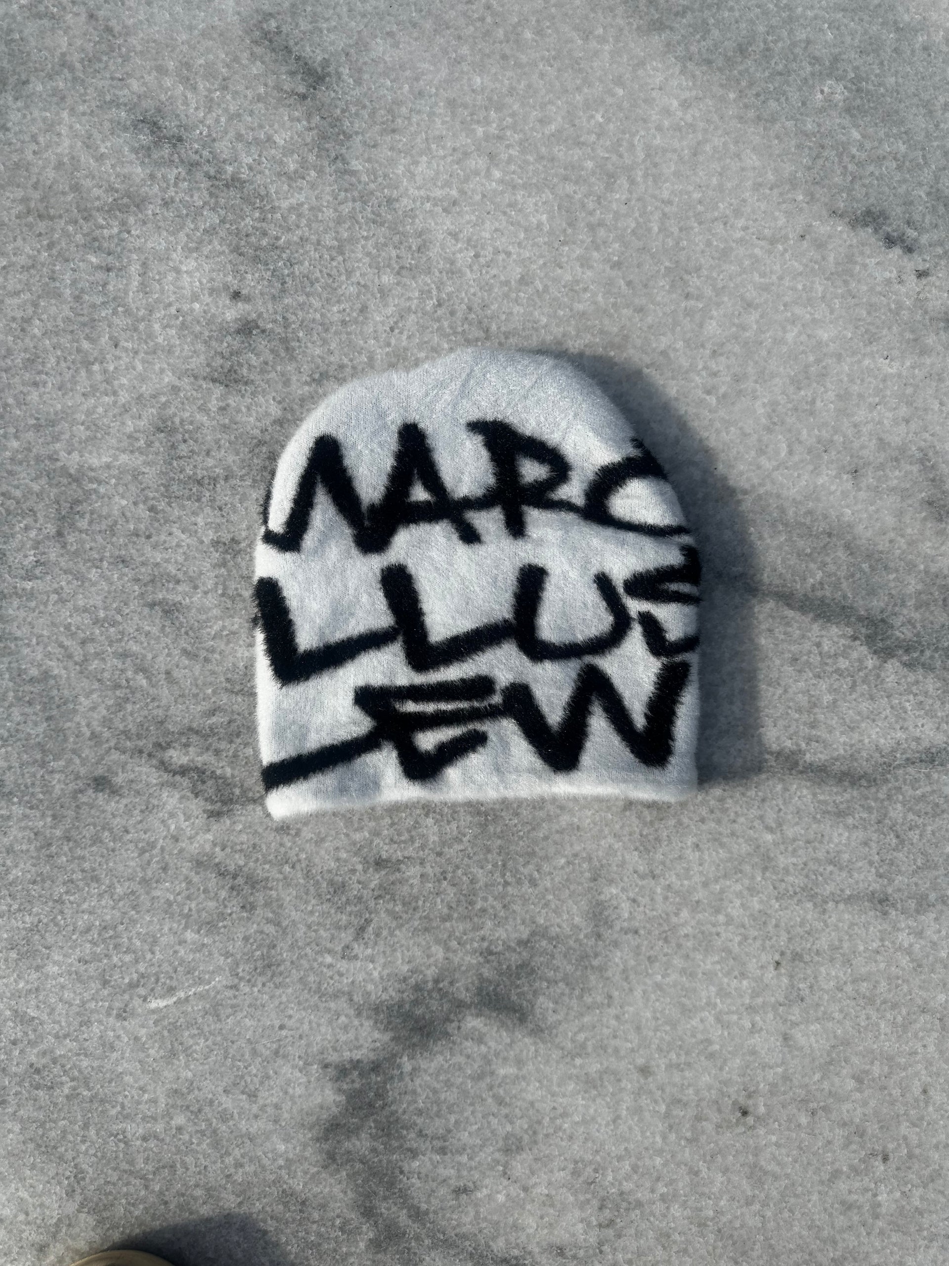 Marcellus Lew Reverse White “Logo Piece Beanie”