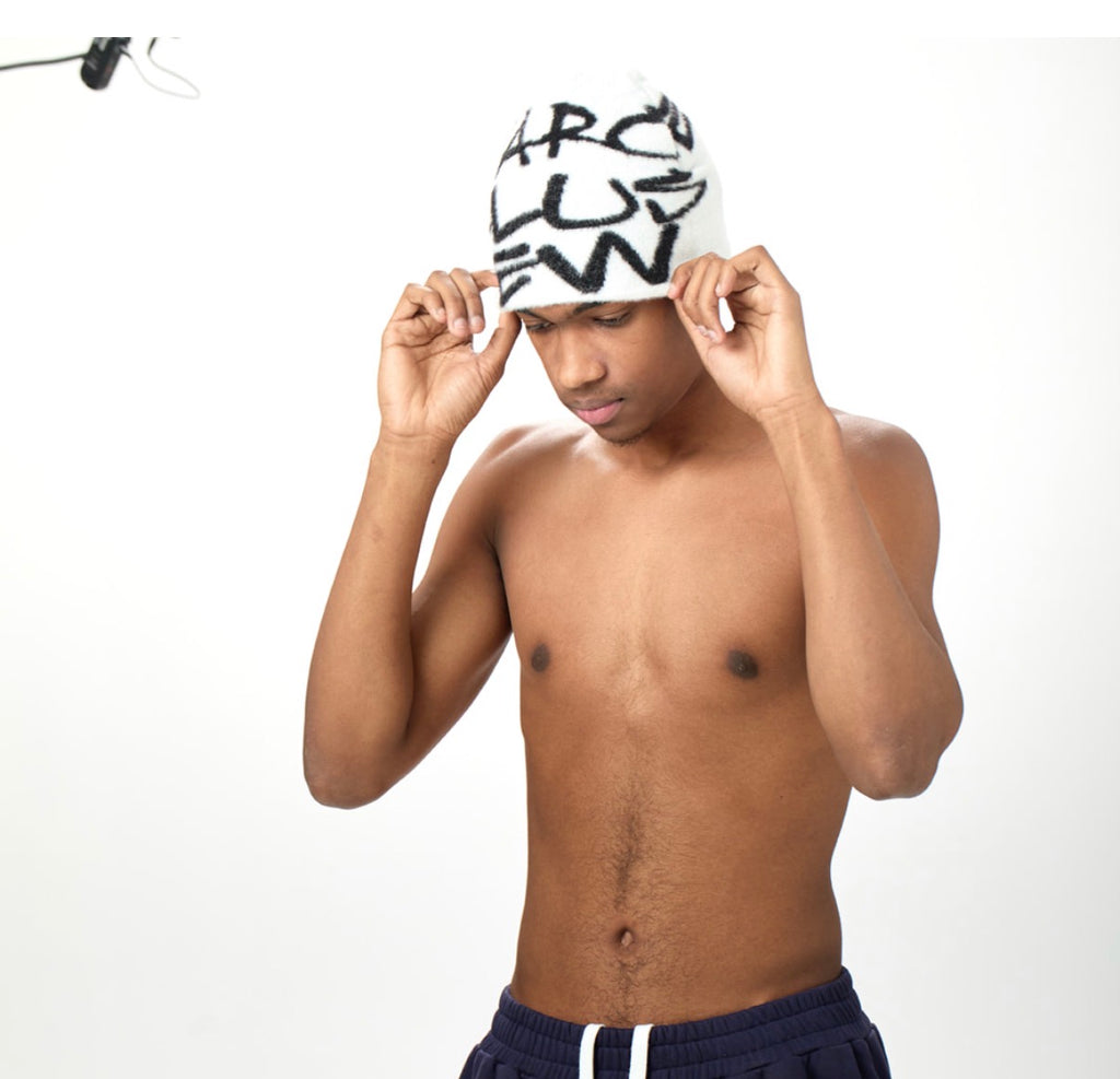 Marcellus Lew Reverse White “Logo Piece Beanie”